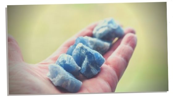 hand holding blue calcite