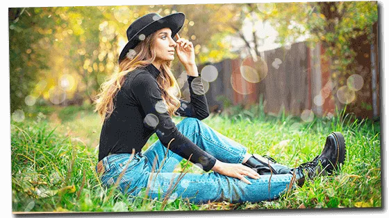 Feminine woman sitting on grass