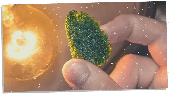 Moldavite being held for good luck 