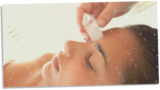 A crystal healing being combined with Reiki