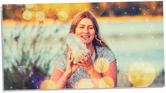 Woman holding a large Reiki crystal