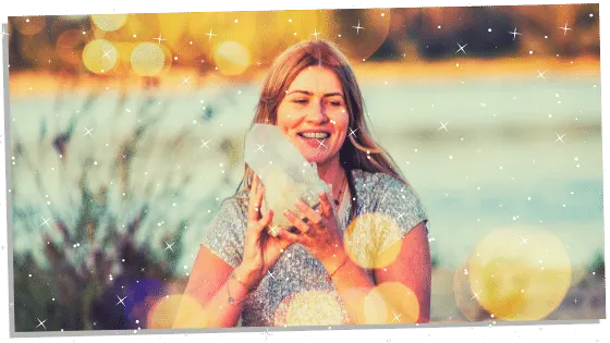 Woman holding a large Reiki crystal