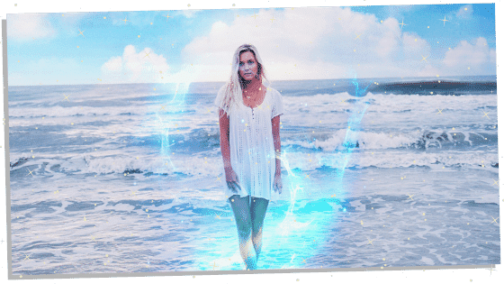 woman on beach with a sky blue aura