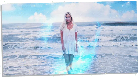 woman on beach with a sky blue aura