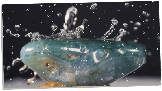 Moss Agate being splashed with water