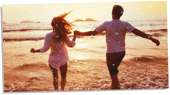 a couple walking on the beach