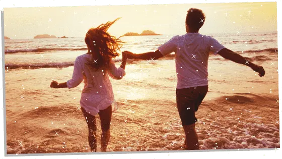 a couple walking on the beach