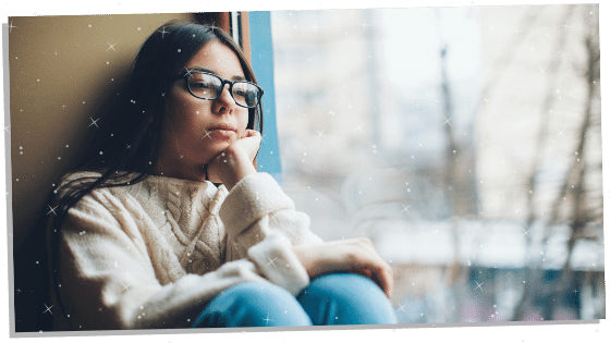 woman looking out the window