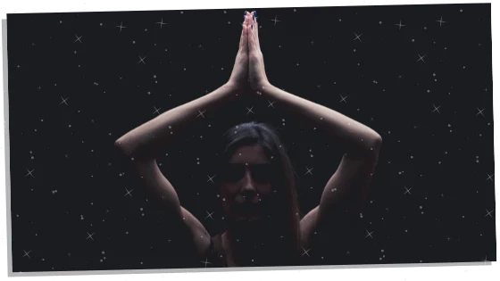 woman meditating in the dark