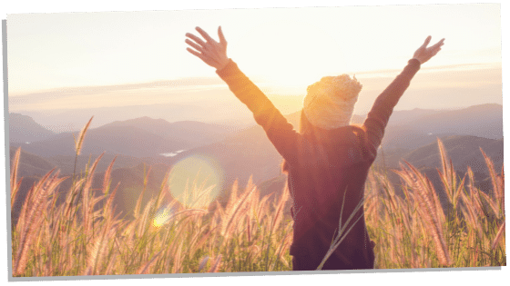 woman cleansing her aura by spending time in nature