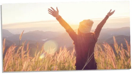 woman cleansing her aura by spending time in nature