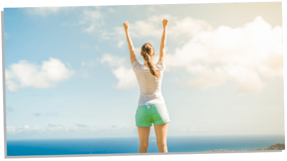 Image of woman with hands in the air