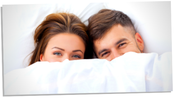 Image of couple in bed 