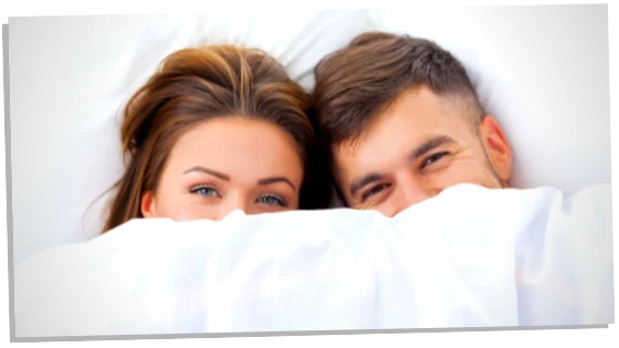 Image of couple in bed 