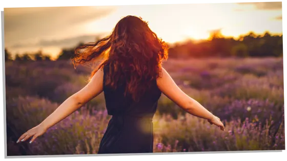 Woman in field letting go of the past