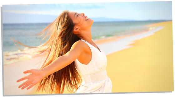 Happy woman enjoying the beach