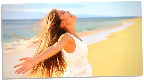 Happy woman enjoying the beach