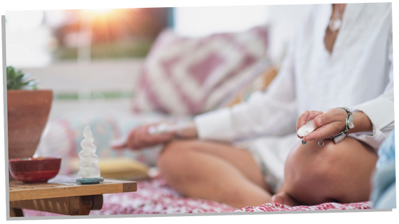 Woman meditating upon crystals