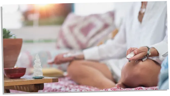 Woman meditating upon crystals