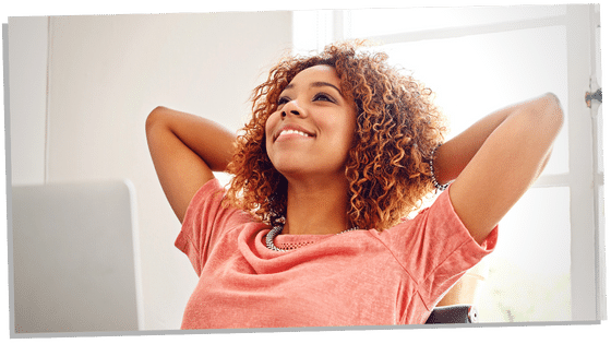 Woman sitting back smilling