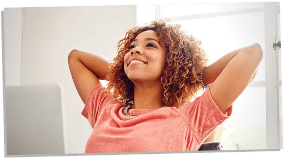 Woman sitting back smilling