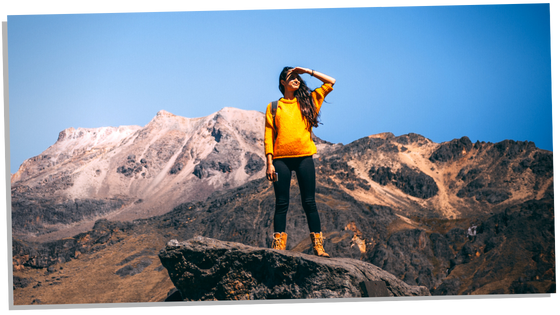 Woman climbing the mountain