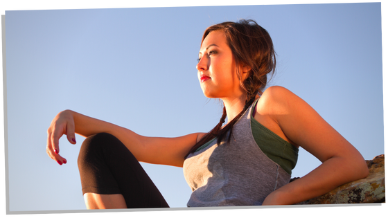 Woman contemplating and feeling relaxed