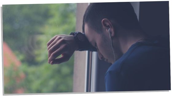 Man showing a sign he sorry for hurting someone by looking sad and giving space to heal