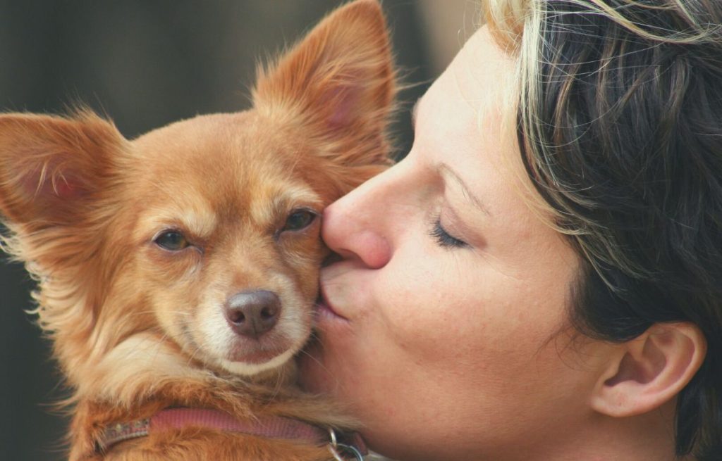 Animal empath kissing her dog